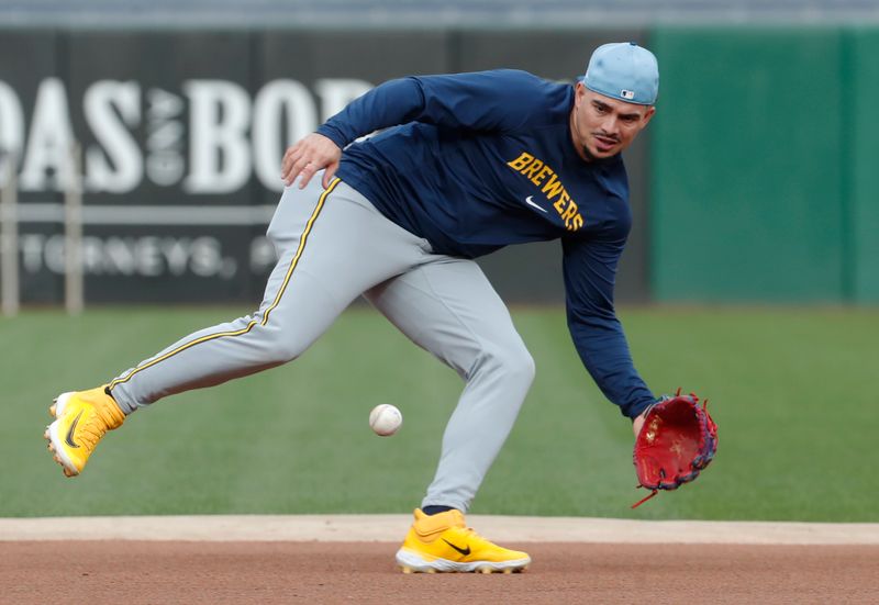 Sep 24, 2024; Pittsburgh, Pennsylvania, USA;  Milwaukee Brewers shortstop Willy Adames (27) takes ground balls before a game against the Pittsburgh Pirates at PNC Park. Mandatory Credit: Charles LeClaire-Imagn Images