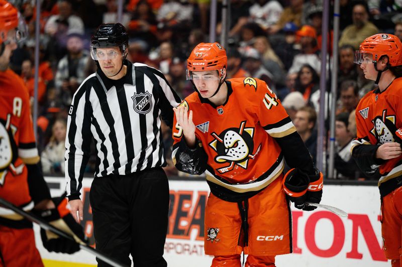 Nov 26, 2025; Anaheim, California, USA; Anaheim Ducks right wing Beckett Sennecke (45) reacts after being hit in the face during the third period against the Vancouver Canucks at Honda Center. Mandatory Credit: William Liang-Imagn Images