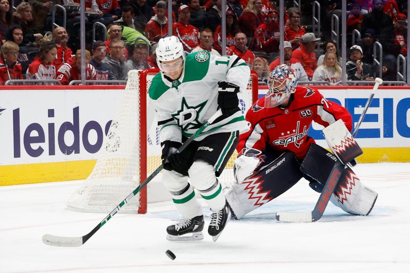 Oct 17, 2024; Washington, District of Columbia, USA; Dallas Stars center Logan Stankoven (11) reaches for the puck in front of Washington Capitals goaltender Charlie Lindgren (79) in the second period at Capital One Arena. Mandatory Credit: Geoff Burke-Imagn Images