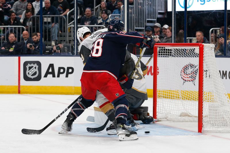 Mar 4, 2024; Columbus, Ohio, USA; Columbus Blue Jackets center Boone Jenner (38) reaches for the rebound of a Vegas Golden Knights goalie Adin Hill (33) save during the second period at Nationwide Arena. Mandatory Credit: Russell LaBounty-USA TODAY Sports