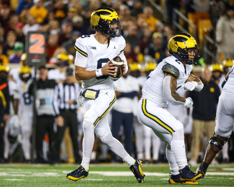 Oct 7, 2023; Minneapolis, Minnesota, USA; Michigan Wolverines quarterback J.J. McCarthy (9) looks to pass against the Minnesota Golden Gophers during the first quarter at Huntington Bank Stadium. Mandatory Credit: Matt Krohn-USA TODAY Sports