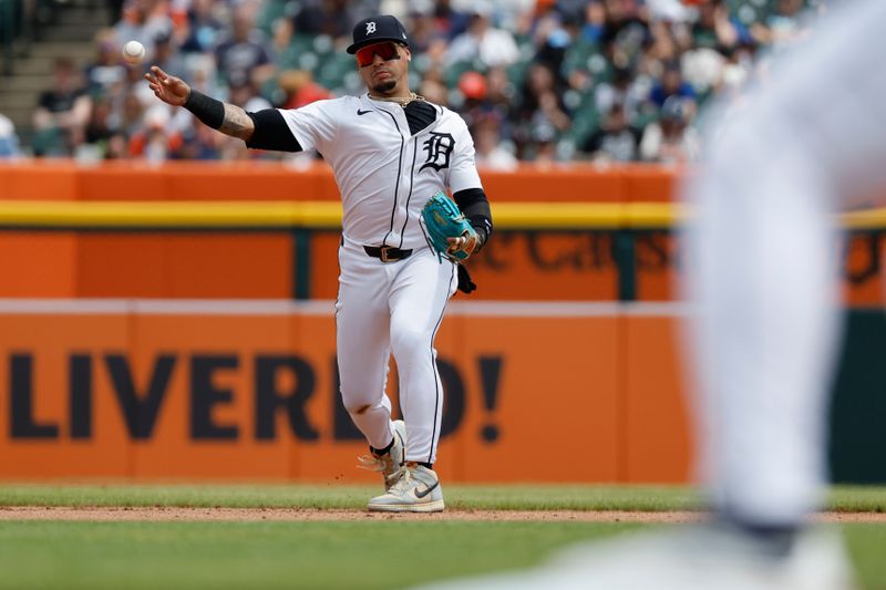 May 15, 2024; Detroit, Michigan, USA; Detroit Tigers shortstop Javier Báez (28) makes a throw to first base in the third inning against the Miami Marlins at Comerica Park. Mandatory Credit: Rick Osentoski-USA TODAY Sports