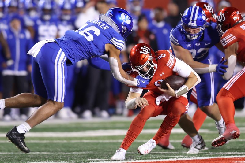 Nov 9, 2024; Salt Lake City, Utah, USA; Brigham Young Cougars linebacker Isaiah Glasker (16) uses the facemask to tackle Utah Utes quarterback Brandon Rose (8) during the second quarter at Rice-Eccles Stadium. Mandatory Credit: Rob Gray-Imagn Images