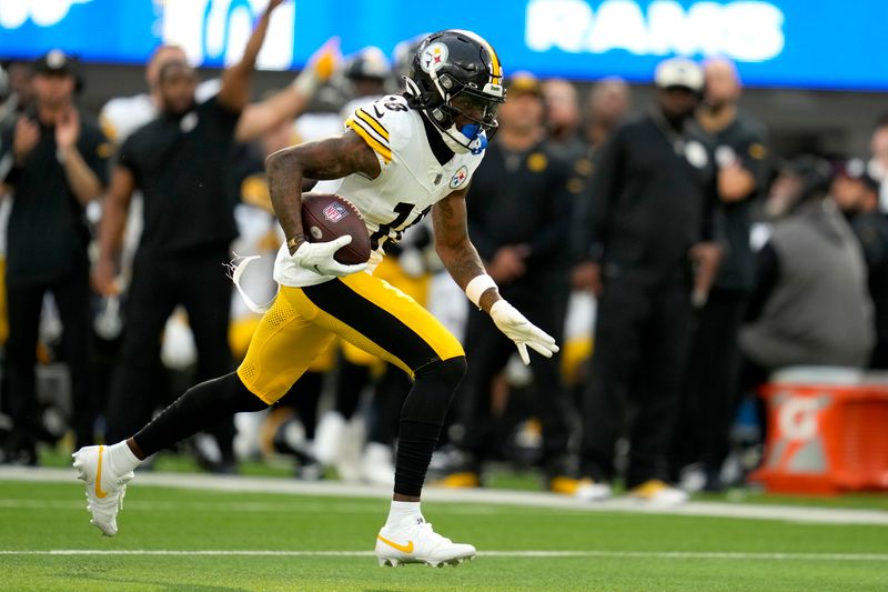 Pittsburgh Steelers wide receiver Diontae Johnson runs the ball during the second half of an NFL football game against the Los Angeles Rams Sunday, Oct. 22, 2023, in Inglewood, Calif. (AP Photo/Ashley Landis)