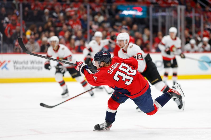 Feb 26, 2024; Washington, District of Columbia, USA; Washington Capitals defenseman Rasmus Sandin (38) shoots the puck against the Ottawa Senators in the third period at Capital One Arena. Mandatory Credit: Geoff Burke-USA TODAY Sports