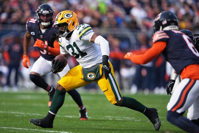 Green Bay Packers' Emanuel Wilson runs during the first half of an NFL football game against the Chicago Bears Sunday, Nov. 17, 2024, in Chicago. (AP Photo/Charles Rex Arbogast)