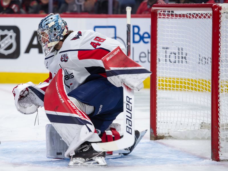 Jan 16, 2025; Ottawa, Ontario, CAN; Washington Capitals goalie Logan Thompson (48) follows the puck in the first period against the Ottawa Senators at the Canadian Tire Centre. Mandatory Credit: Marc DesRosiers-Imagn Images