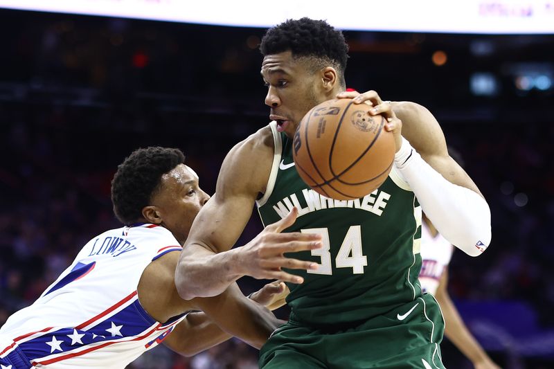 PHILADELPHIA, PENNSYLVANIA - FEBRUARY 25: Giannis Antetokounmpo #34 of the Milwaukee Bucks dribbles by Kyle Lowry #7 of the Philadelphia 76ers during the fourth quarter at the Wells Fargo Center on February 25, 2024 in Philadelphia, Pennsylvania. (Photo by Tim Nwachukwu/Getty Images)