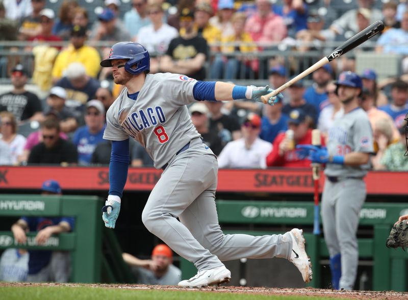 May 1, 2025; Pittsburgh, Pennsylvania, USA;  Chicago Cubs left fielder Ian Happ (8) hits a single against the Pittsburgh Pirates during the seventh inning at PNC Park. Mandatory Credit: Charles LeClaire-Imagn Images