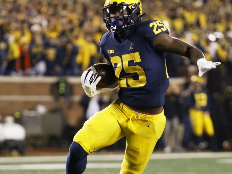 Nov 6, 2021; Ann Arbor, Michigan, USA; Michigan Wolverines running back Hassan Haskins (25) rushes in the first half against the Indiana Hoosiers at Michigan Stadium. Mandatory Credit: Rick Osentoski-USA TODAY Sports