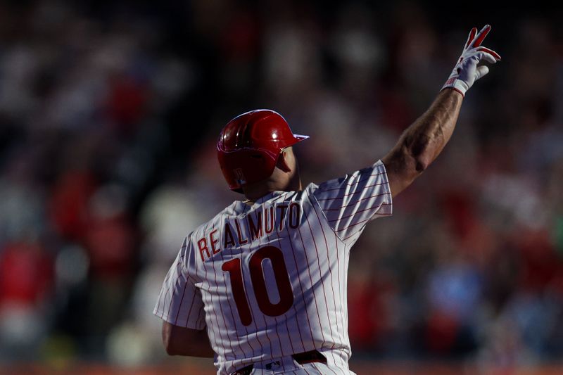 Apr 30, 2025; Philadelphia, Pennsylvania, USA; Philadelphia Phillies catcher J.T. Realmuto (10) reacts after hitting a home run during the eighth inning against the Washington Nationals at Citizens Bank Park. Mandatory Credit: Bill Streicher-Imagn Images