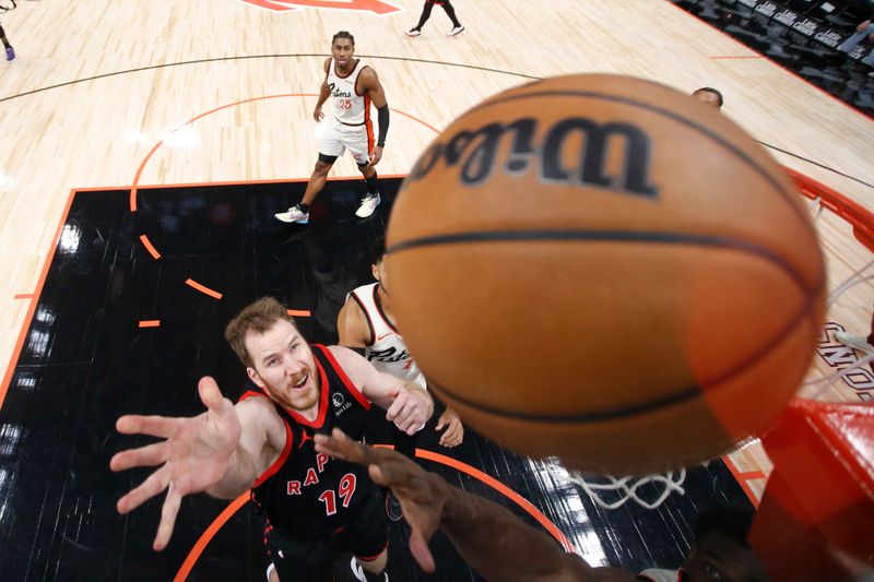 DETROIT, MI - NOVEMBER 25:  Jakob Poeltl #19 of the Toronto Raptors shoots the ball during the game against the Detroit Pistons on November 25, 2024 at Little Caesars Arena in Detroit, Michigan. NOTE TO USER: User expressly acknowledges and agrees that, by downloading and/or using this photograph, User is consenting to the terms and conditions of the Getty Images License Agreement. Mandatory Copyright Notice: Copyright 2024 NBAE (Photo by Brian Sevald/NBAE via Getty Images)