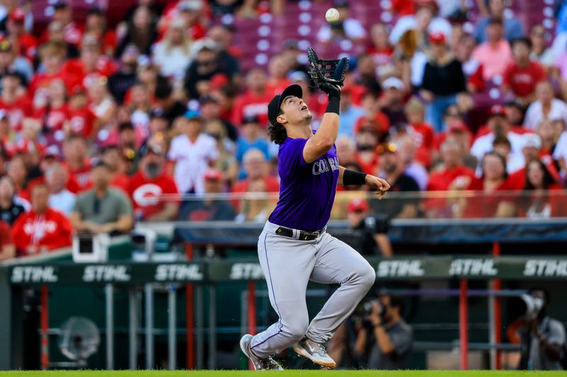 Jul 10, 2024; Cincinnati, Ohio, USA; Colorado Rockies first baseman Michael Toglia (4) catches a pop up hit by Cincinnati Reds second baseman Santiago Espinal (not pictured) in the third inning at Great American Ball Park. Mandatory Credit: Katie Stratman-USA TODAY Sports