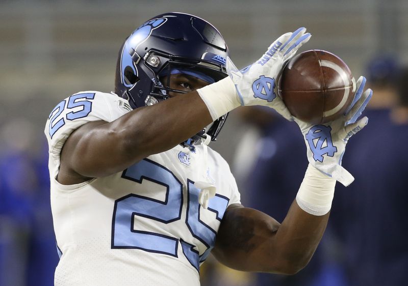 Nov 14, 2019; Pittsburgh, PA, USA;  North Carolina Tar Heels running back Javonte Williams (25) warms up before playing the Pittsburgh Panthers at Heinz Field. Mandatory Credit: Charles LeClaire-USA TODAY Sports