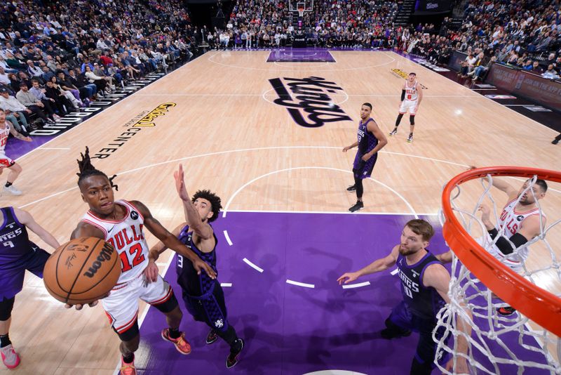 SACRAMENTO, CA - MARCH 4: Ayo Dosunmu #12 of the Chicago Bulls drives to the basket during the game against the Sacramento Kings on March 4, 2024 at Golden 1 Center in Sacramento, California. NOTE TO USER: User expressly acknowledges and agrees that, by downloading and or using this Photograph, user is consenting to the terms and conditions of the Getty Images License Agreement. Mandatory Copyright Notice: Copyright 2024 NBAE (Photo by Rocky Widner/NBAE via Getty Images)