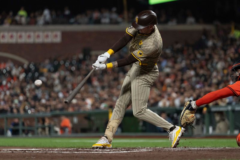 Sep 13, 2024; San Francisco, California, USA;  San Diego Padres outfielder Jackson Merrill (3) hits a double during the fourth inning against the San Francisco Giants at Oracle Park. Mandatory Credit: Stan Szeto-Imagn Images