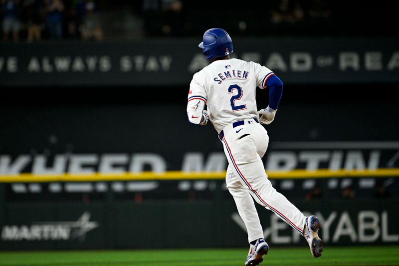 Jun 3, 2024; Arlington, Texas, USA; Texas Rangers second baseman Marcus Semien (2) rounds the bases after he hits a leadoff home run against the Detroit Tigers during the first inning at Globe Life Field. Mandatory Credit: Jerome Miron-USA TODAY Sports