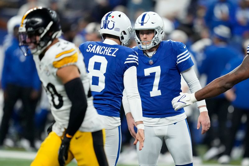 Indianapolis Colts place-kicker Matt Gay (7) celebrates with Rigoberto Sanchez (8) after a field goal during the second half of an NFL football game against the Pittsburgh Steelers in Indianapolis Saturday, Dec. 16, 2023. (AP Photo/Michael Conroy)