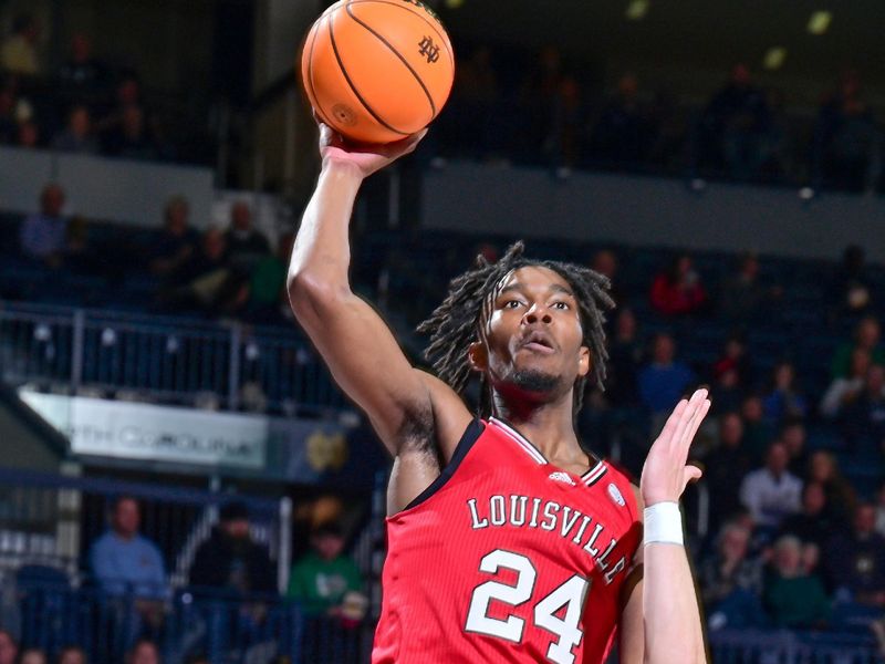 Jan 28, 2023; South Bend, Indiana, USA; Louisville Cardinals forward Jae'Lyn Withers (24) shoots the ball against Notre Dame Fighting Irish guard Dane Goodwin (23) in the first half at the Purcell Pavilion. Mandatory Credit: Matt Cashore-USA TODAY Sports