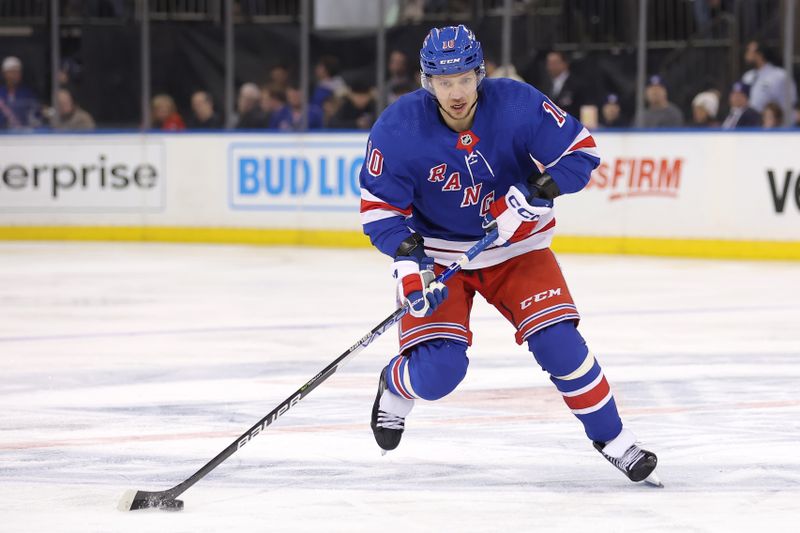 Feb 12, 2024; New York, New York, USA; New York Rangers left wing Artemi Panarin (10) skates with the puck against the Calgary Flames during the first period at Madison Square Garden. Mandatory Credit: Brad Penner-USA TODAY Sports