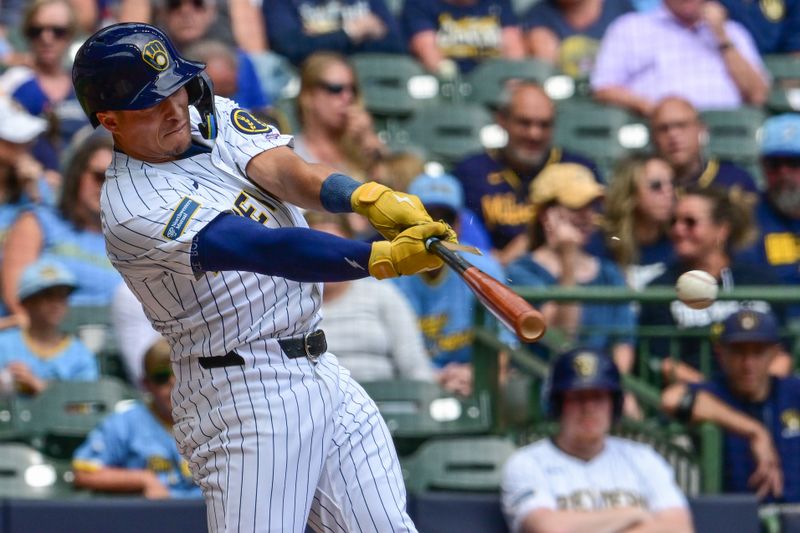 Sep 8, 2024; Milwaukee, Wisconsin, USA; Milwaukee Brewers left fielder Isaac Collins (6) hits a single for his first major league hit in the second inning against the Colorado Rockies at American Family Field. Mandatory Credit: Benny Sieu-Imagn Images