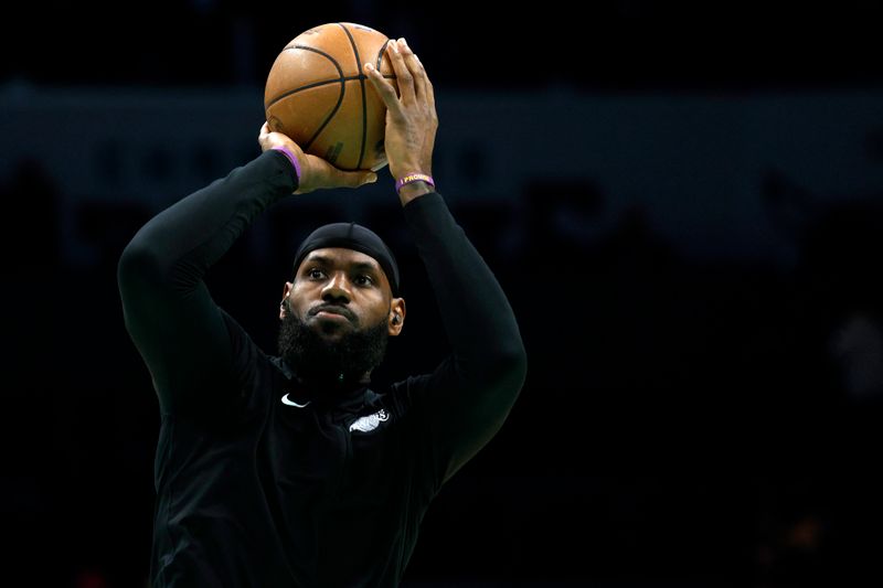 CHARLOTTE, NORTH CAROLINA - JANUARY 02: LeBron James #6 of the Los Angeles Lakers warms up prior to the game against the Charlotte Hornets at Spectrum Center on January 02, 2023 in Charlotte, North Carolina. NOTE TO USER: User expressly acknowledges and agrees that, by downloading and or using this photograph, User is consenting to the terms and conditions of the Getty Images License Agreement. (Photo by Jared C. Tilton/Getty Images)