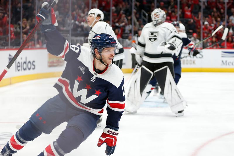 Jan 7, 2024; Washington, District of Columbia, USA; Washington Capitals right wing Nic Dowd (26) celebrates after scoring a goal past Los Angeles Kings goaltender Cam Talbot (39) during the second period at Capital One Arena. Mandatory Credit: Amber Searls-USA TODAY Sports