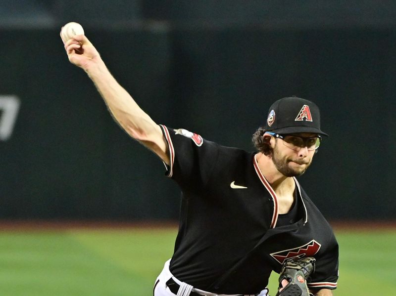 Apr 26, 2023; Phoenix, Arizona, USA; Arizona Diamondbacks starting pitcher Zac Gallen (23) throws in the first inning against the Kansas City Royals at Chase Field. Mandatory Credit: Matt Kartozian-USA TODAY Sports