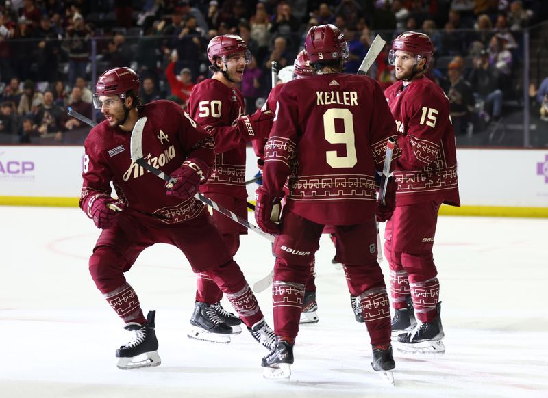 Nov 30, 2023; Tempe, Arizona, USA; Arizona Coyotes center Nick Schmaltz (8) celebrates a goal with teammates against the Colorado Avalanche in the second period at Mullett Arena. Mandatory Credit: Mark J. Rebilas-USA TODAY Sports