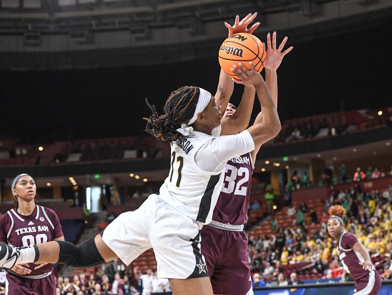 Mar 1, 2023; Greenville, SC, USA; Vanderbilt guard Ciaja Harbison (11) has a shot blocked by Texas A&M forward Aaliyah Patty (32) late during the fourth quarter of the SEC Women's Basketball Tournament at Bon Secours Wellness Arena. Mandatory Credit: Ken Ruinard-USA TODAY Sports