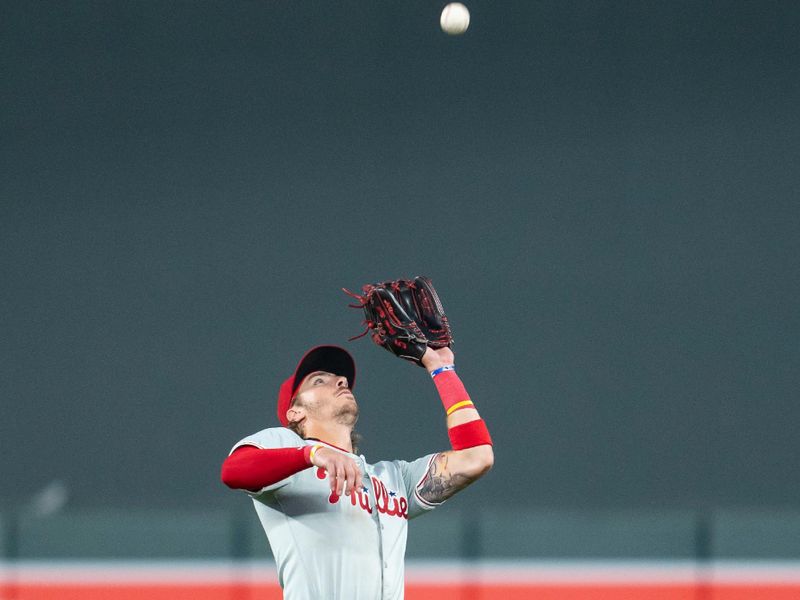 Jul 22, 2024; Minneapolis, Minnesota, USA; Philadelphia Phillies second baseman Bryson Stott (5) catches a fly ball against the Philadelphia Phillies in the fourth inning at Target Field. Mandatory Credit: Jesse Johnson-USA TODAY Sports