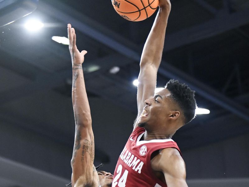 Feb 11, 2023; Auburn, Alabama, USA;  Auburn Tigers guard Allen Flanigan (22) defends a shot by Alabama Crimson Tide forward Brandon Miller (24) at Neville Arena. Mandatory Credit: Julie Bennett-USA TODAY Sports

