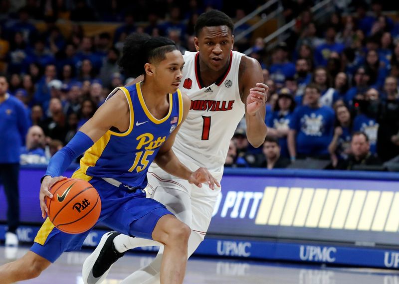 Feb 17, 2024; Pittsburgh, Pennsylvania, USA;  Pittsburgh Panthers guard Jaland Lowe (15) drives to the basket past Louisville Cardinals guard Curtis Williams (1) during the first half at the Petersen Events Center. Mandatory Credit: Charles LeClaire-USA TODAY Sports