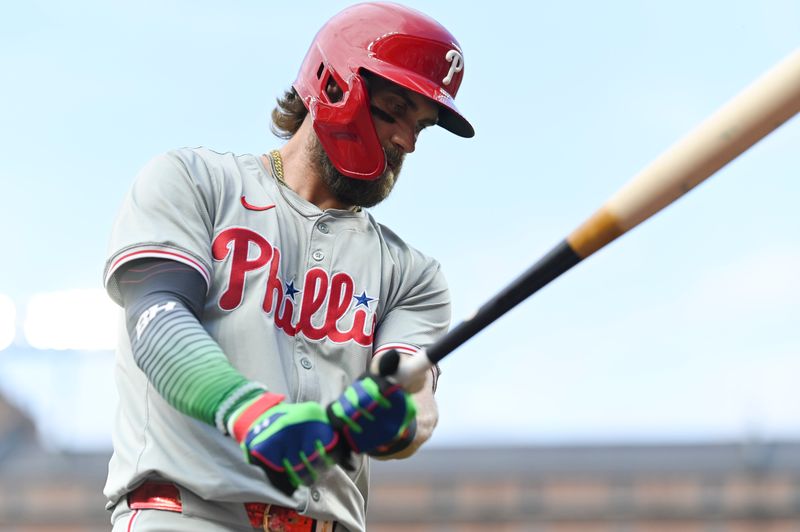 Jun 14, 2024; Baltimore, Maryland, USA;  Philadelphia Phillies first baseman Bryce Harper (3) warms up prior to a first inning at-bat against the Baltimore Orioles at Oriole Park at Camden Yards. Mandatory Credit: Tommy Gilligan-USA TODAY Sports