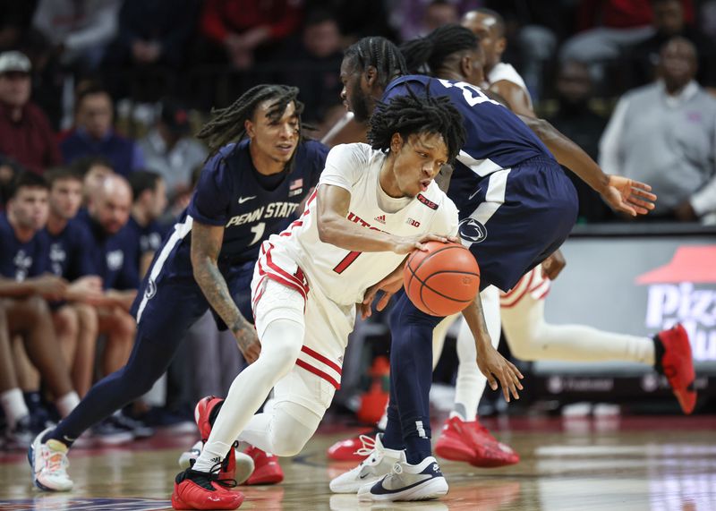 Jan 31, 2024; Piscataway, New Jersey, USA; Rutgers Scarlet Knights guard Jamichael Davis (1) dribbles asPenn State Nittany Lions forward Qudus Wahab (22) and guard Ace Baldwin Jr. (1) defend during the first half at Jersey Mike's Arena. Mandatory Credit: Vincent Carchietta-USA TODAY Sports