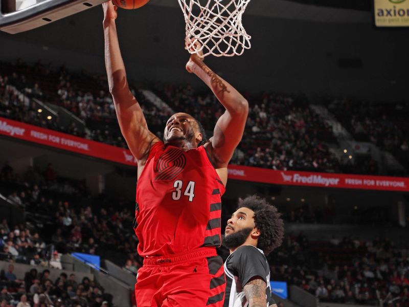 PORTLAND, OR - DECEMBER 13: Jabari Walker #34 of the Portland Trail Blazers drives to the basket during the game against the San Antonio Spurs on December 13, 2024 at the Moda Center Arena in Portland, Oregon. NOTE TO USER: User expressly acknowledges and agrees that, by downloading and or using this photograph, user is consenting to the terms and conditions of the Getty Images License Agreement. Mandatory Copyright Notice: Copyright 2024 NBAE (Photo by Cameron Browne/NBAE via Getty Images)