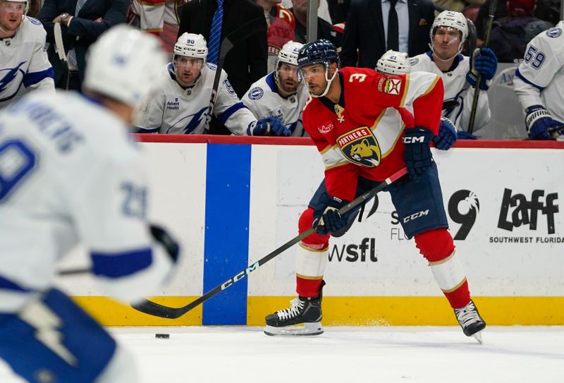 Dec 27, 2025; Sunrise, Florida, USA; Florida Panthers defenseman Seth Jones (3) moves the puck against the Tampa Bay Lightning during the third period at Amerant Bank Arena. Mandatory Credit: Jeff Romance-Imagn Images