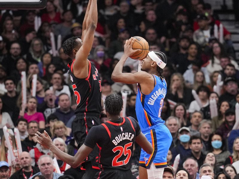 TORONTO, ON - MARCH 16: Shai Gilgeous-Alexander #2 of the Oklahoma City Thunder goes to the basket against Christian Koloko #35 of the Toronto Raptors during the second half of their basketball game at the Scotiabank Arena on March 16, 2023 in Toronto, Ontario, Canada. NOTE TO USER: User expressly acknowledges and agrees that, by downloading and/or using this Photograph, user is consenting to the terms and conditions of the Getty Images License Agreement. (Photo by Mark Blinch/Getty Images)