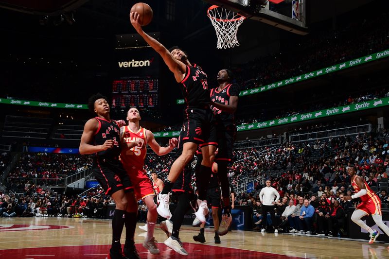 ATLANTA, GA - JANUARY 28: Jordan Nwora #13 of the Toronto Raptors grabs the rebound during the game against the Atlanta Hawks on January 28, 2024 at State Farm Arena in Atlanta, Georgia.  NOTE TO USER: User expressly acknowledges and agrees that, by downloading and/or using this Photograph, user is consenting to the terms and conditions of the Getty Images License Agreement. Mandatory Copyright Notice: Copyright 2024 NBAE (Photo by Scott Cunningham/NBAE via Getty Images)