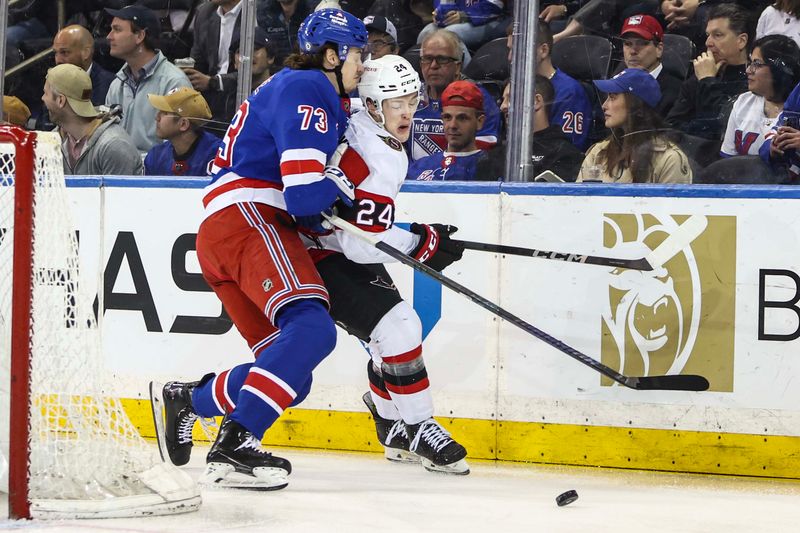 Apr 15, 2024; New York, New York, USA;  New York Rangers center Matt Rempe (73) and Ottawa Senators defenseman Jacob Bernard-Docker (24) battle for control of the puck in the first period at Madison Square Garden. Mandatory Credit: Wendell Cruz-USA TODAY Sports