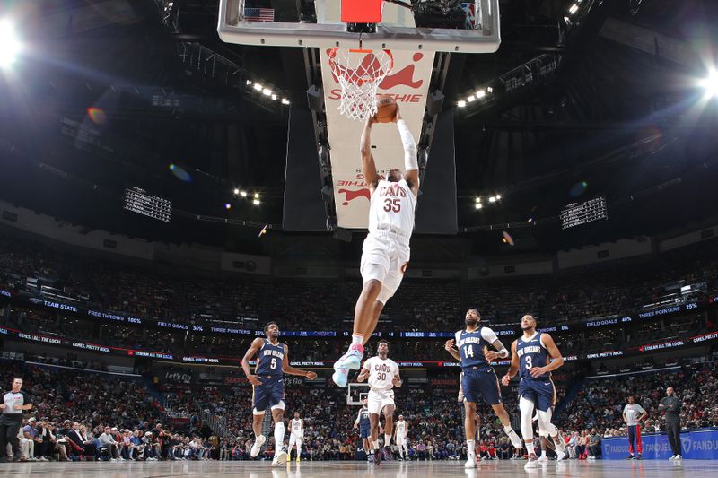 NEW ORLEANS, LA - MARCH 13: Isaac Okoro #35 of the Cleveland Cavaliers dunks the ball during the game against the New Orleans Pelicans on March 13, 2024 at the Smoothie King Center in New Orleans, Louisiana. NOTE TO USER: User expressly acknowledges and agrees that, by downloading and or using this Photograph, user is consenting to the terms and conditions of the Getty Images License Agreement. Mandatory Copyright Notice: Copyright 2024 NBAE (Photo by Layne Murdoch Jr./NBAE via Getty Images)