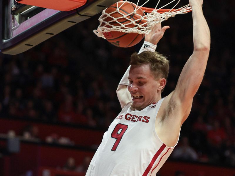 Nov 10, 2023; Piscataway, New Jersey, USA; Rutgers Scarlet Knights forward Oskar Palmquist (9) dunks the ball during the second half against the Boston University Terriers at Jersey Mike's Arena. Mandatory Credit: Vincent Carchietta-USA TODAY Sports