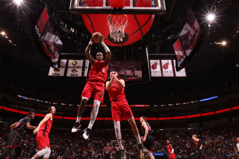 MIAMI, FL - DECEMBER 12:  Terry Rozier #2 of the Miami Heat rebounds the ball during the game against the Toronto Raptors on December 12, 2024 at Kaseya Center in Miami, Florida. NOTE TO USER: User expressly acknowledges and agrees that, by downloading and or using this Photograph, user is consenting to the terms and conditions of the Getty Images License Agreement. Mandatory Copyright Notice: Copyright 2024 NBAE (Photo by Issac Baldizon/NBAE via Getty Images)