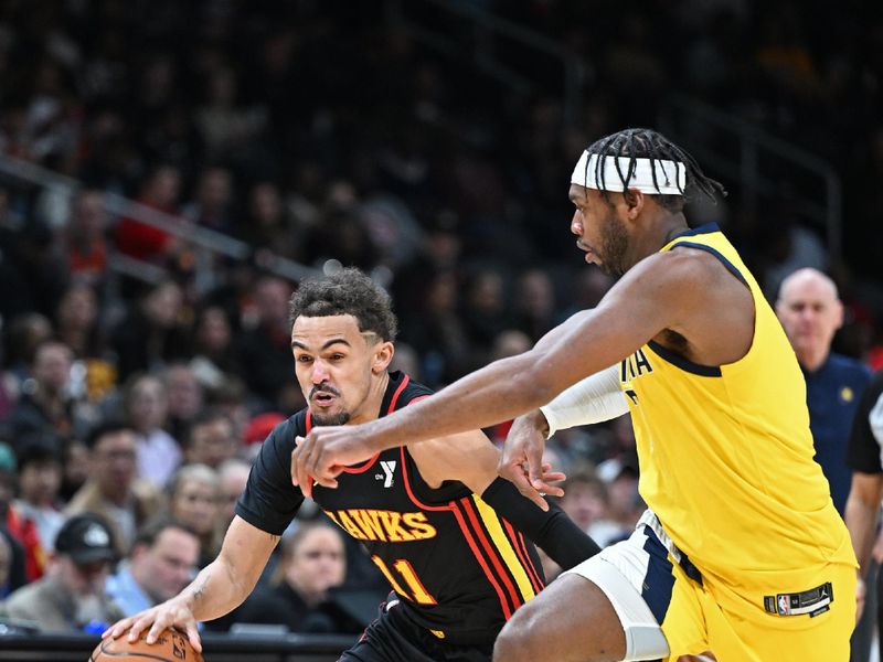 ATLANTA, GA - JANUARY 12: Trae Young #11 of the Atlanta Hawks dribbles the ball during the game against the Indiana Pacers on January 12, 2024 at State Farm Arena in Atlanta, Georgia.  NOTE TO USER: User expressly acknowledges and agrees that, by downloading and/or using this Photograph, user is consenting to the terms and conditions of the Getty Images License Agreement. Mandatory Copyright Notice: Copyright 2024 NBAE (Photo by Adam Hagy/NBAE via Getty Images)