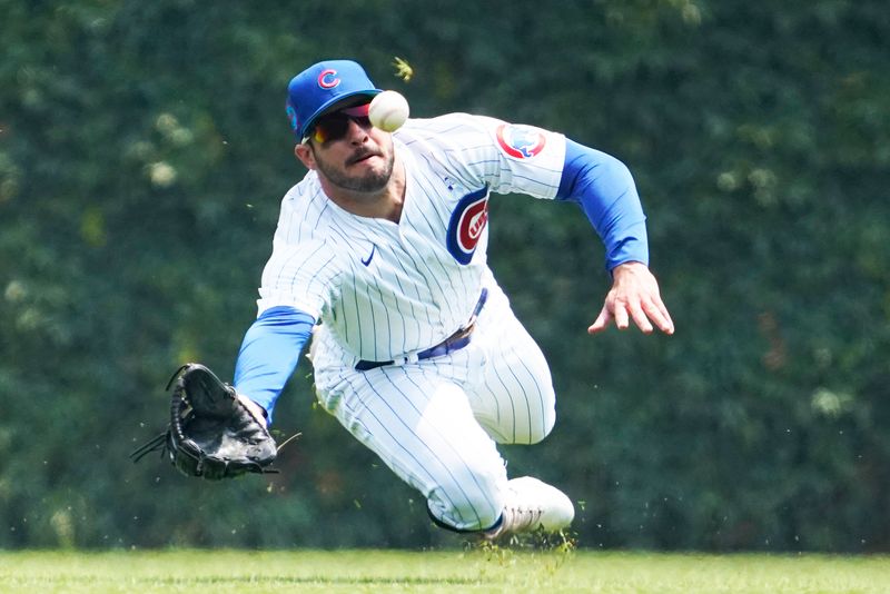 Jun 18, 2023; Chicago, Illinois, USA; Chicago Cubs center fielder Mike Tauchman (40) can t make a catch on Baltimore Orioles left fielder Austin Hays (21) during the first inning at Wrigley Field. Mandatory Credit: David Banks-USA TODAY Sports