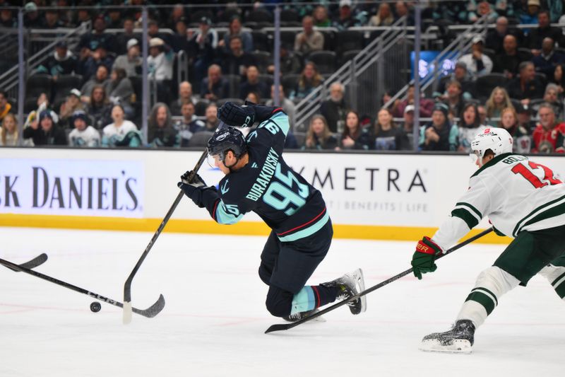 Mar 4, 2025; Seattle, Washington, USA; Seattle Kraken left wing Andre Burakovsky (95) plays the puck during the third period against the Minnesota Wild at Climate Pledge Arena. Mandatory Credit: Steven Bisig-Imagn Images