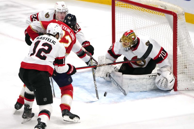 Feb 20, 2024; Sunrise, Florida, USA; Florida Panthers center Kevin Stenlund (82) tries to get a shot off as Ottawa Senators center Mark Kastelic (12) and defenseman Jacob Bernard-Docker (24) defend on the play steering the shot wide of goaltender Joonas Korpisalo (70) during the second period at Amerant Bank Arena. Mandatory Credit: Jim Rassol-USA TODAY Sports