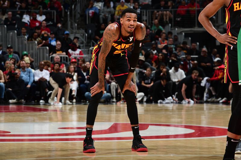 ATLANTA, GA - MARCH 28: Dejounte Murray #5 of the Atlanta Hawks looks on during the game against the Boston Celtics on March 28, 2024 at State Farm Arena in Atlanta, Georgia.  NOTE TO USER: User expressly acknowledges and agrees that, by downloading and/or using this Photograph, user is consenting to the terms and conditions of the Getty Images License Agreement. Mandatory Copyright Notice: Copyright 2024 NBAE (Photo by Scott Cunningham/NBAE via Getty Images)