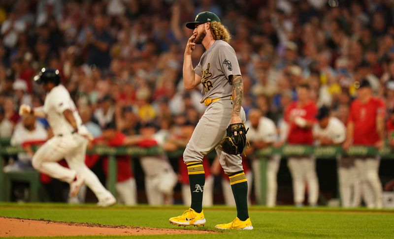 Jul 9, 2024; Boston, Massachusetts, USA; Oakland Athletics starting pitcher Joey Estes (68) looks on as Boston Red Sox third baseman Rafael Devers (11) hits a double to drive in a run in the second inning at Fenway Park. Mandatory Credit: David Butler II-USA TODAY Sports