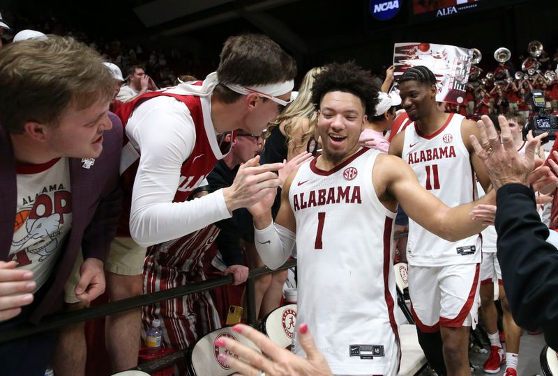 Feb 21, 2024; Tuscaloosa, Alabama, USA;  Alabama Crimson Tide guard Mark Sears (1) celebrates with fans after a win against the Florida Gators at Coleman Coliseum. Mandatory Credit: Gary Cosby Jr.-USA TODAY Sports